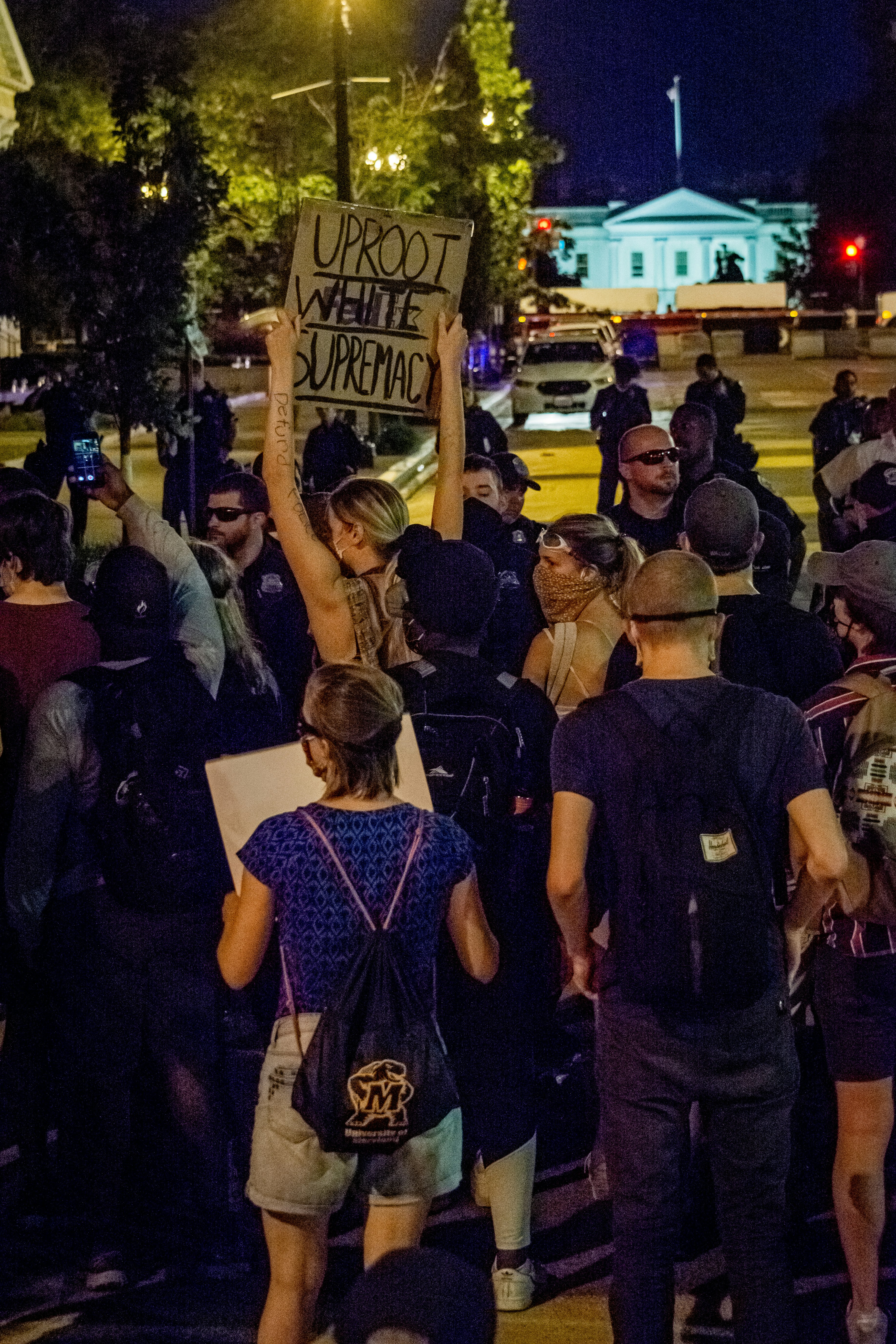 people standing on street during night time